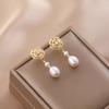 Natural freshwater camellia pearl stud earrings women's niche hollow design sense S925 silver needle simple Korean long earrings