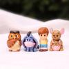 10 figurine de acțiune cu Winnie the Pooh, un personaj de desene animate Disney, inclusiv Pooh însuși și prietenii săi
