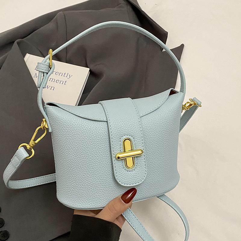 

New popular high-end lychee pattern solid color portable bucket bag fashionable versatile niche commuter style messenger women s bag