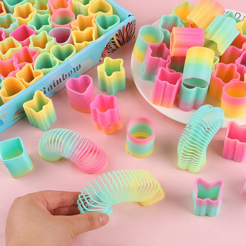 12/24 Stück Regenbogen Magische Feder Hüpfspielzeug Kindergeburtstag Mitgebsel Goodie Piñata Füller Fidget Spielzeug Kreative Weihnachtsgeschenke