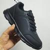 All-black sports shoes, new casual running shoes in autumn, leather shoes that are not tired after standing for a long time
