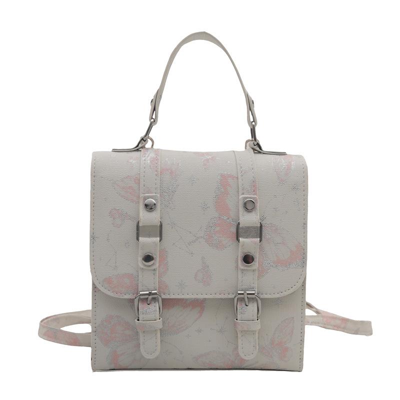 

Simple foreign style niche design bag women s 2024 autumn new fashion leisure personalized backpack commuter oblique span bag розовый