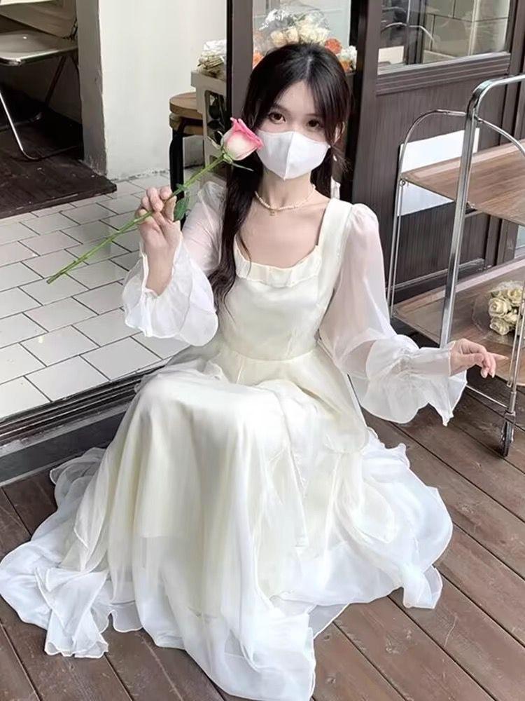 Spot French first love ruffle edge long-sleeved dress women's autumn and winter 2026 new design sense niche waist dress