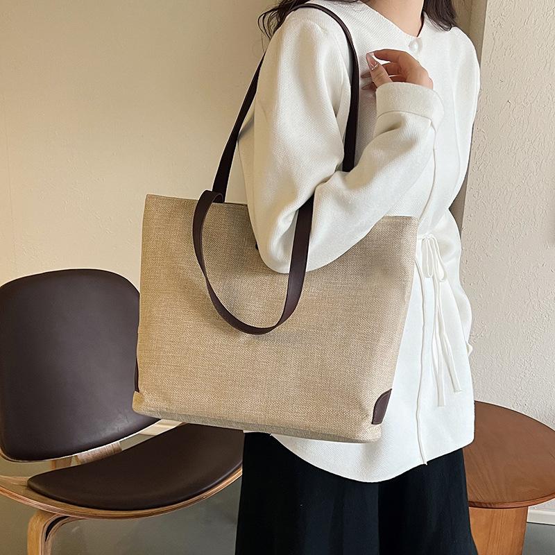 Cotton and linen casual tote bags are hot-selling large-capacity portable bucket bags, fashionable and simple solid-color shoulder bags.