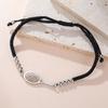 Gioiello Sportivo Minimalista in Acciaio Inossidabile con Intaglio Racchetta e Cordino Intrecciato Personalizzabile