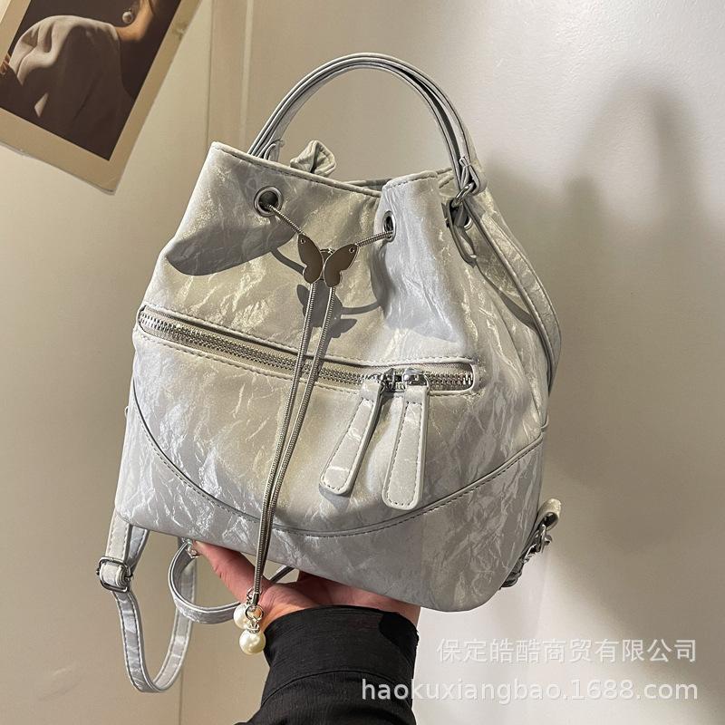 Silver bag women's 2025 new fashion backpack design sense school bag college student shoulder crossbody bucket bag