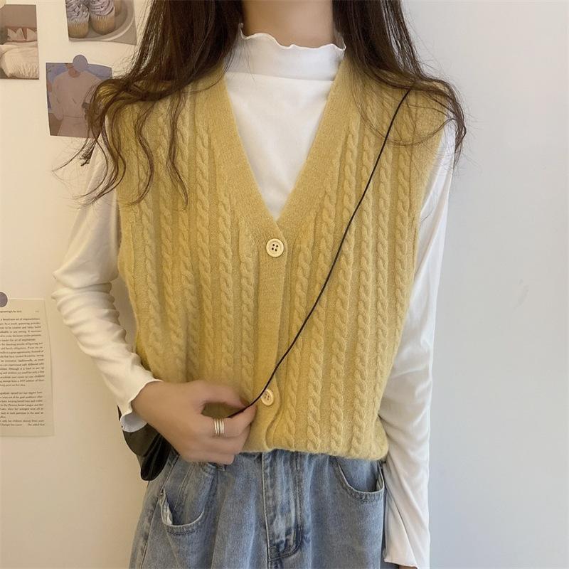 Knitted Vest, Short Top, Sleeveless Sweater Worn On Top A Small Woman with A Cardigan and A Camisole Shoulder