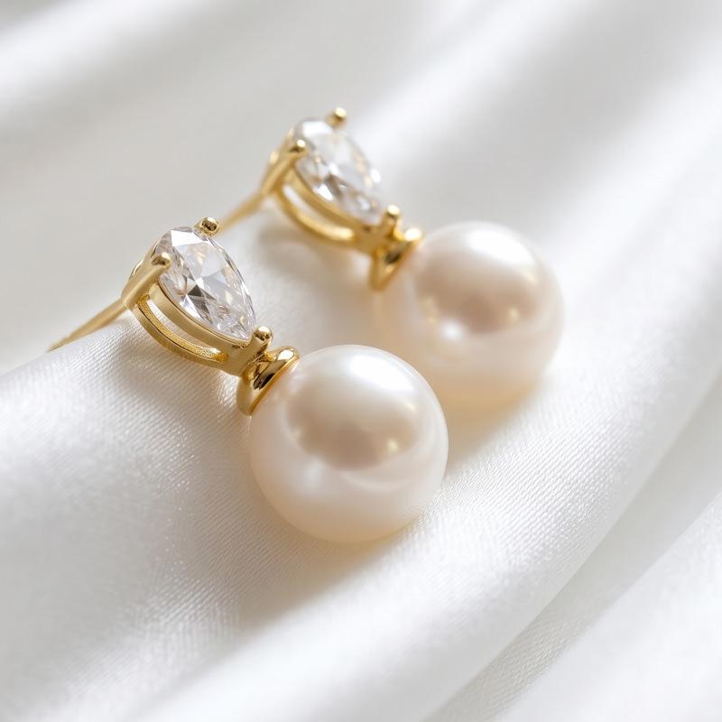 Hot-selling light luxury pearl zircon earrings women's fashion commuter versatile earrings high-end stud earrings copper