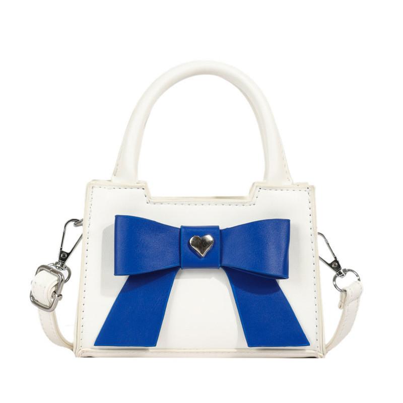 Stylish Korean Toddler Shoulder Bag For Kids Featuring Chic Color Block Design And Sweet Bow Detail
