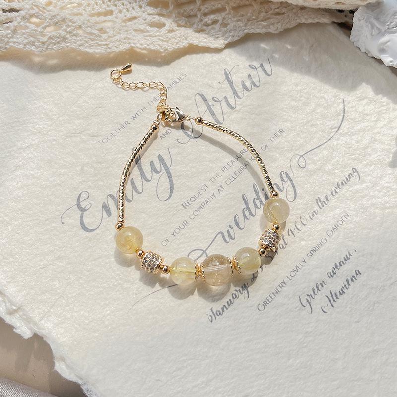 

Qiaoen Women s Minimalist Adjustable Golden Rutilated Quartz Beaded Bracelet