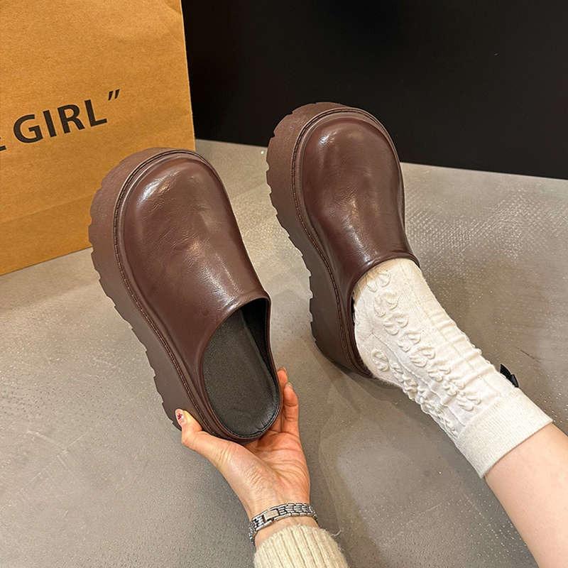 Height-increasing thick-soled slippers women's outer wear summer new super hot Internet celebrity black high-heeled half-support bag head slippers