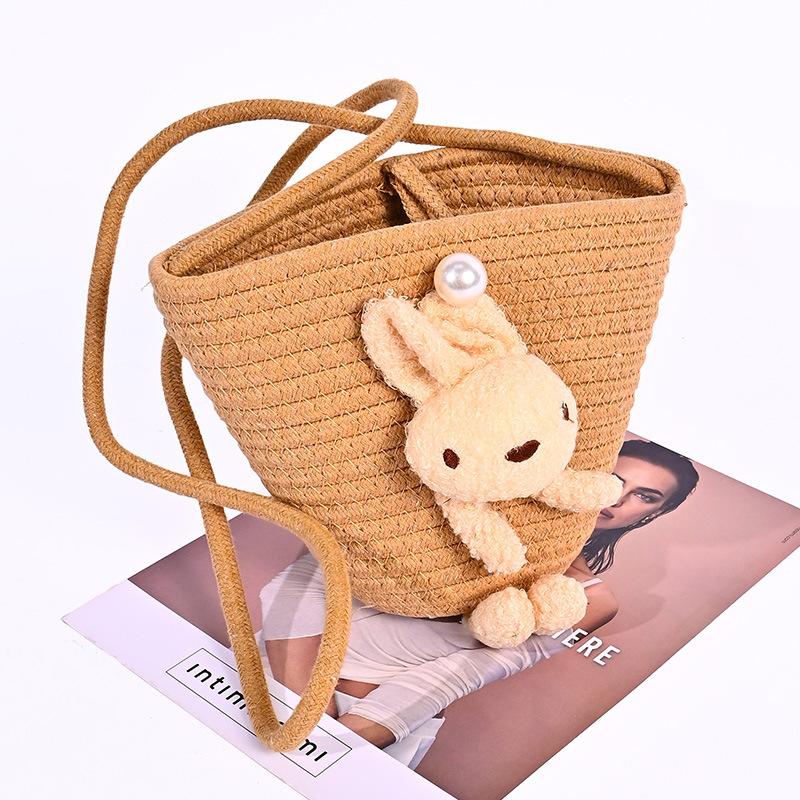 

Summer cute oblique bucket bag women s straw woven outdoor travel beach bag versatile plush rabbit shoulder bag One Size