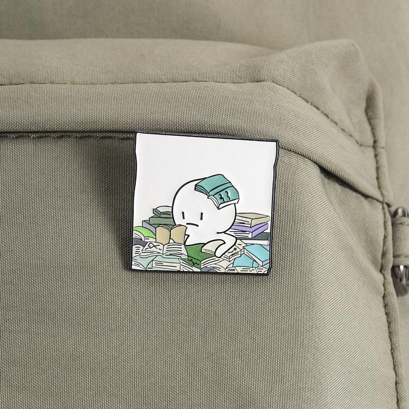 Cartoon Overwhelmed Book Lover Enamel Pin Exaggerated Figure Buried In Books Lapel Brooch Humorous Gift For Teens