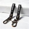 1Pcs Car Metal Key Chain Fine Leather Emblem Key Ring Accessories For Dacia Bigster Spring Duster Sandero Jogger Dokker Lodgy