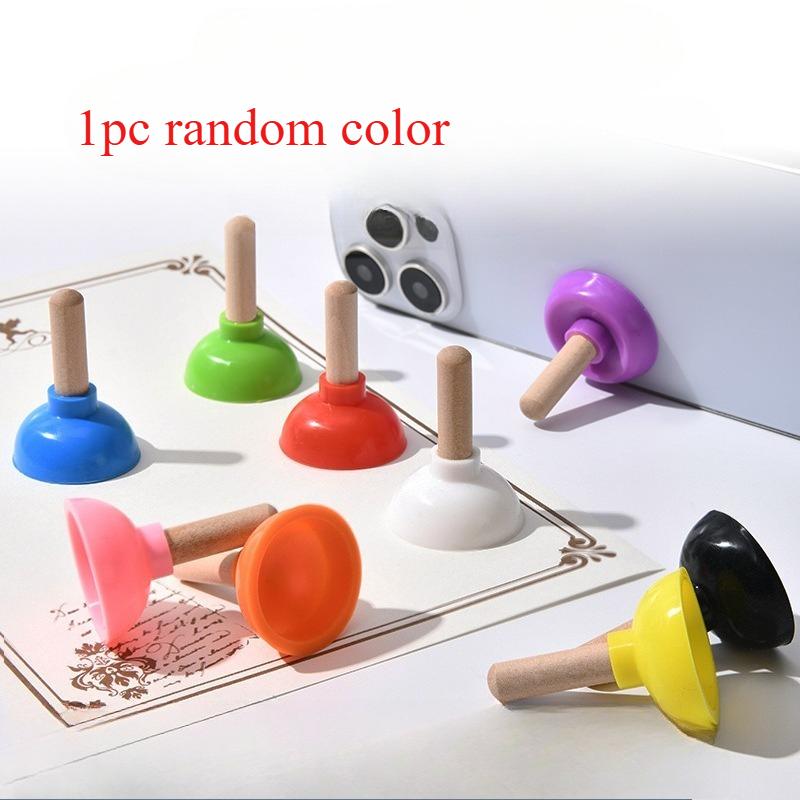 

A Multifunctional Silicone Toilet Plunger Phone Holder with a Suction Cup, Perfect As a Quirky Gift Or Toy
