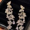 Silver Zirconia Bow Tassel Earrings: Korean Style, Exaggerated Luxury Ear Stud Ornaments.