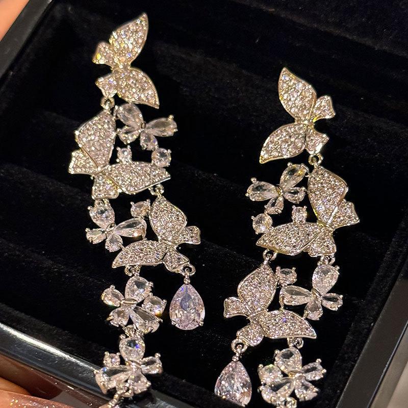 Silver Zirconia Bow Tassel Earrings: Korean Style, Exaggerated Luxury Ear Stud Ornaments.