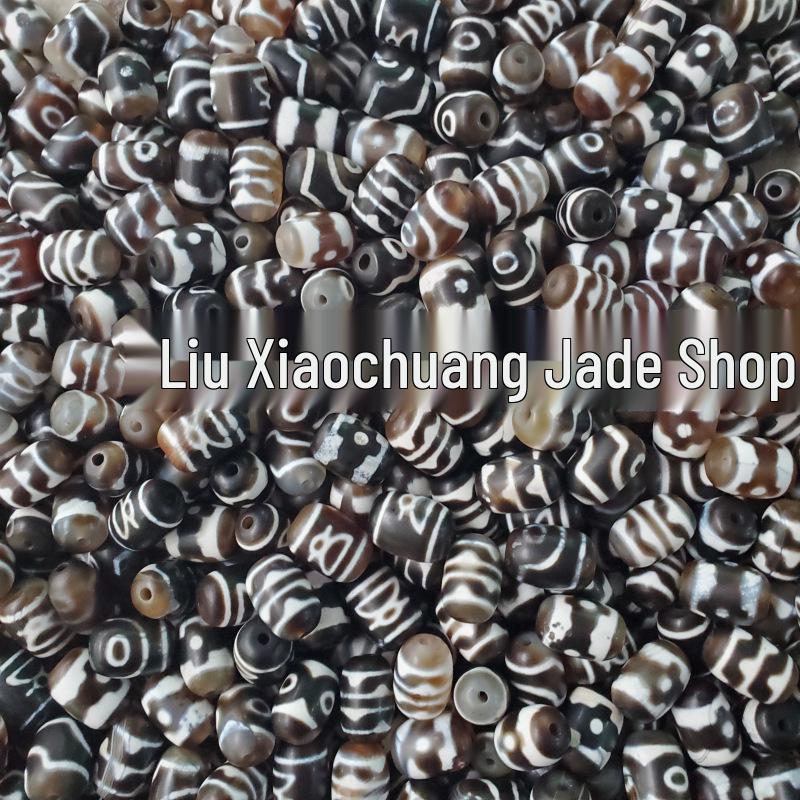 

Nine-Eyed Agate Dzi and Jade Beads – Tiger Tooth Design in Coffee Color Various patterns, color variations