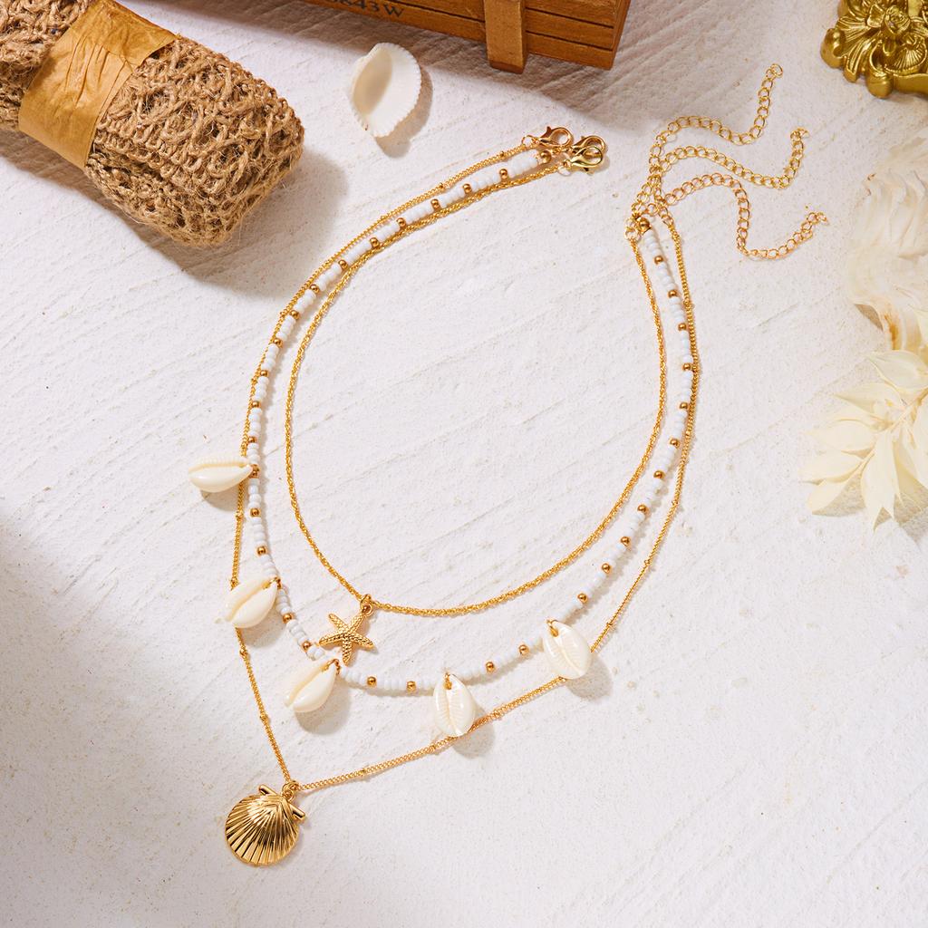 Jemný přívěsek náhrdelník s mušlí a hvězdicí z rýžových korálků pro ženy Boho Hvězdice Vrstvený klíční kost řetízek Šperky na plážovou párty Dárek