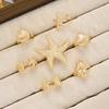 7 Pcs Gold Metal Ring Set for Women Starfish Shell Geometric Flower Knuckle Rings Vintage Daily Stackable Fashion Jewelry Gifts