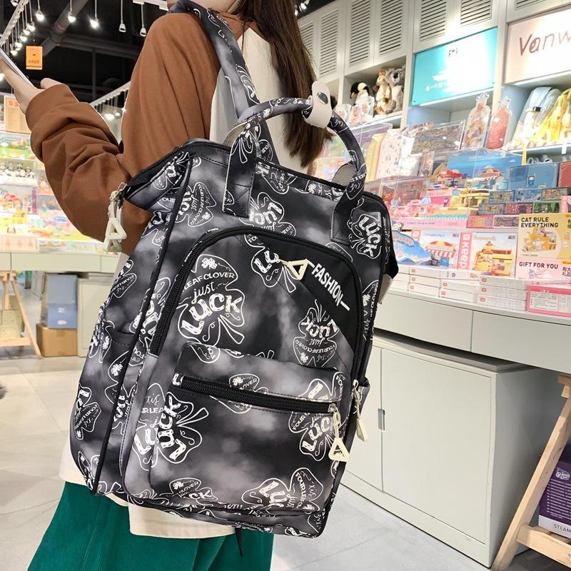 Harajuku printed portable clip student schoolbag Korean version large-capacity backpack