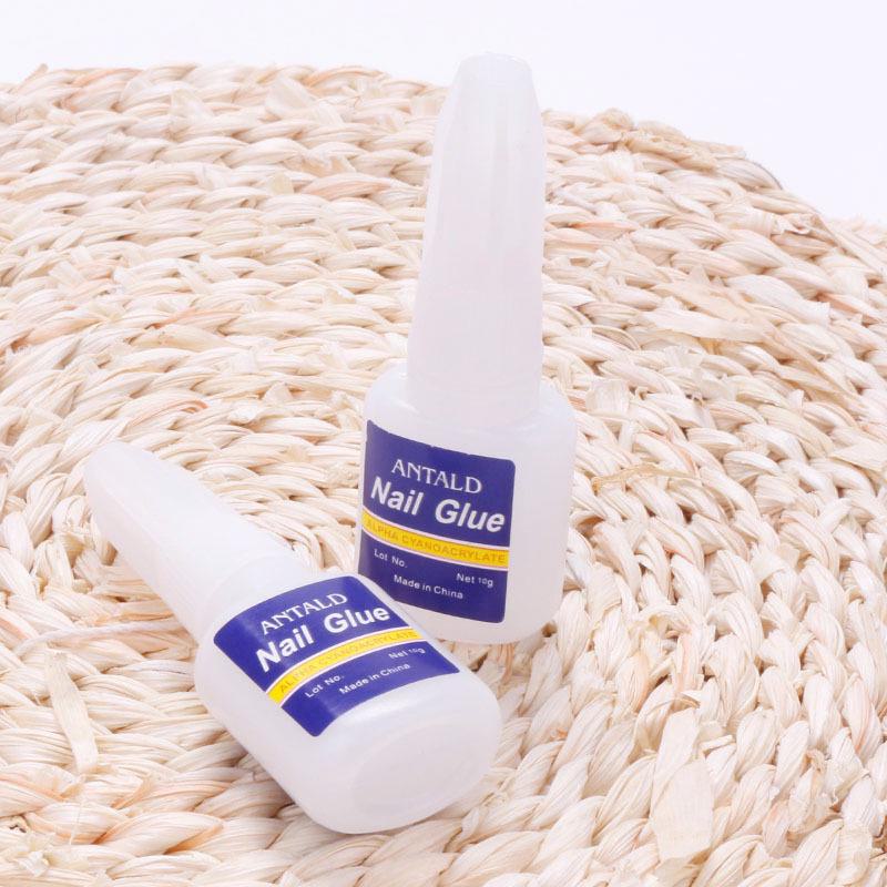 Quick-Dry Nail Glue 10g with Brush Head - Strong Adhesive for Nails and Rhinestones (Blue Bottle)