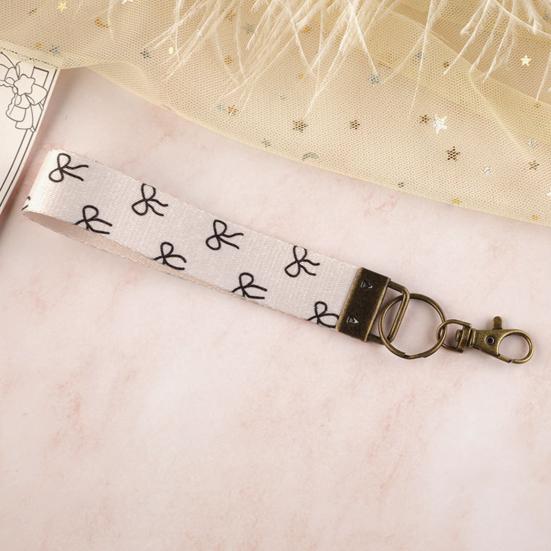 Nyckelring Hänge Rutigt Tryck Faux Läder Handledsrem Nyckelring Armband med Snabbfäste Fjäderring Kvinnor Nyckelhållare