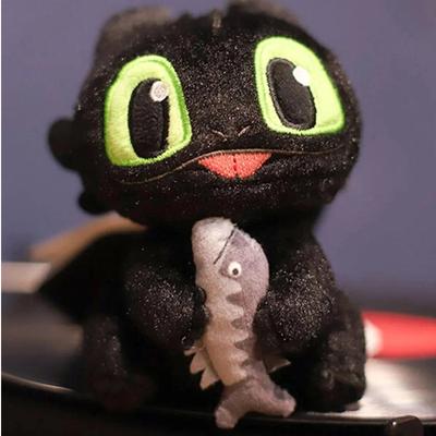 Poupée Peluche Toothless Dompteur de Dragons Universal Studios Réelle Tenant une Poupée Poisson Poupée Sac d'École Cadeau Mignon