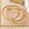 Trend European and American Personality Twist Opening Adjustable Twist Steel Wire Gold Ball Bracelet 2026