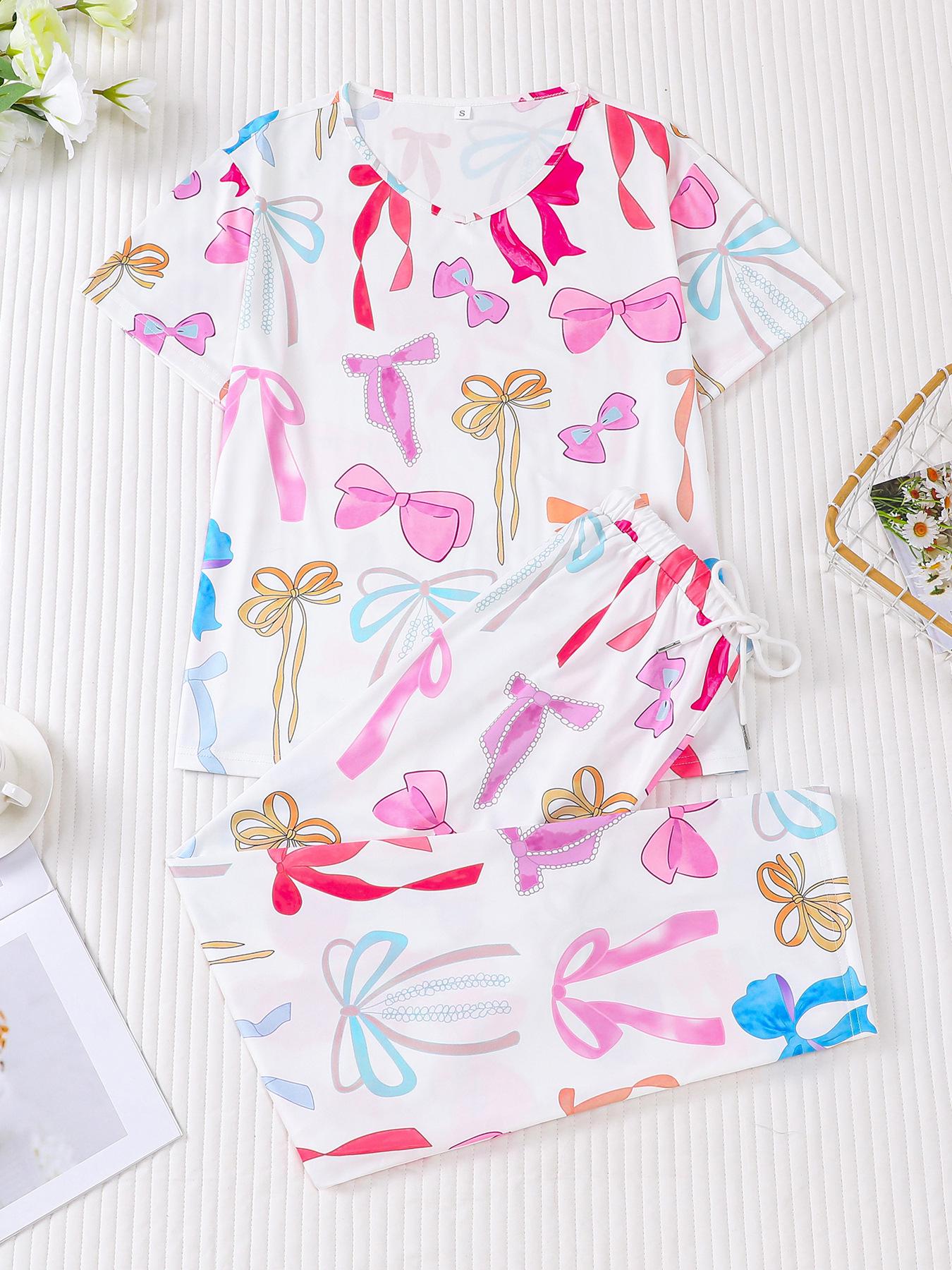 

Женский пижамный комплект с принтом бабочек - Топ с коротким рукавом и длинные брюки Medium