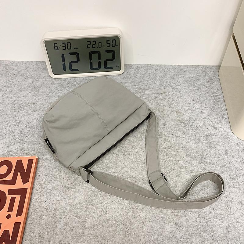

The bag is simple and versatile, small and camping wind adjustable, shoulder crossbody travel bag, washed nylon bag. серый