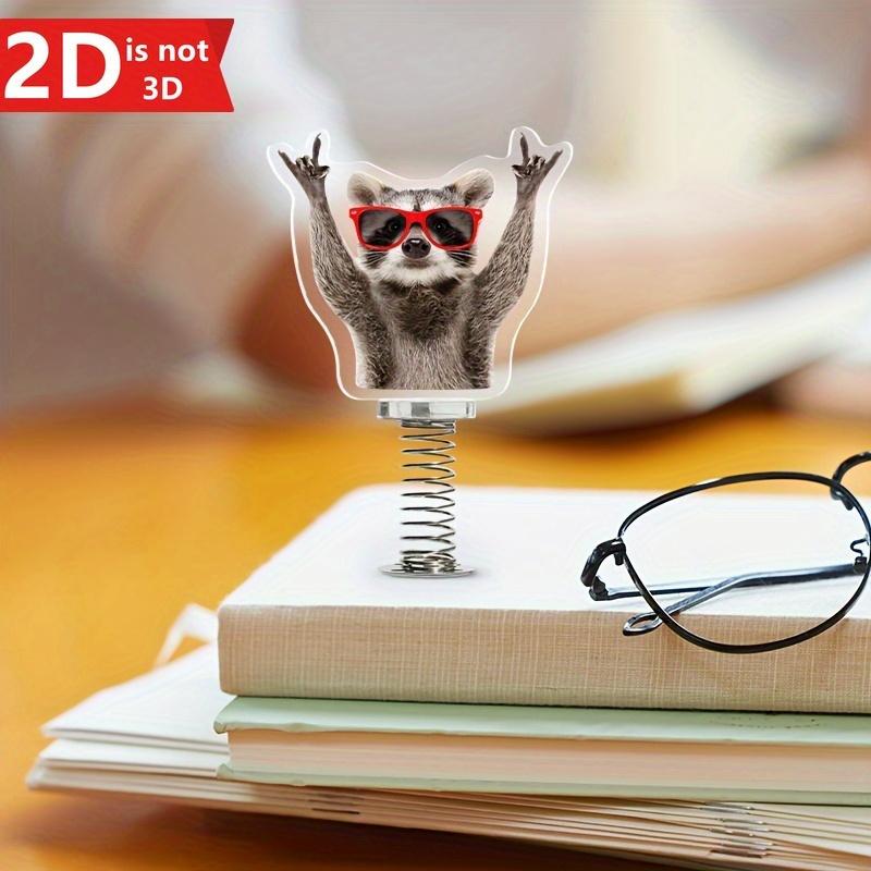 Cute 2D Swinging Raccoon, a spring-driven decoration for desktops and car interiors.