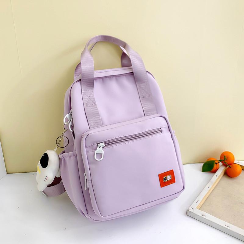 Unisex Primary School Student Backpack Waterproof Handbag With Colorful Patchwork Design