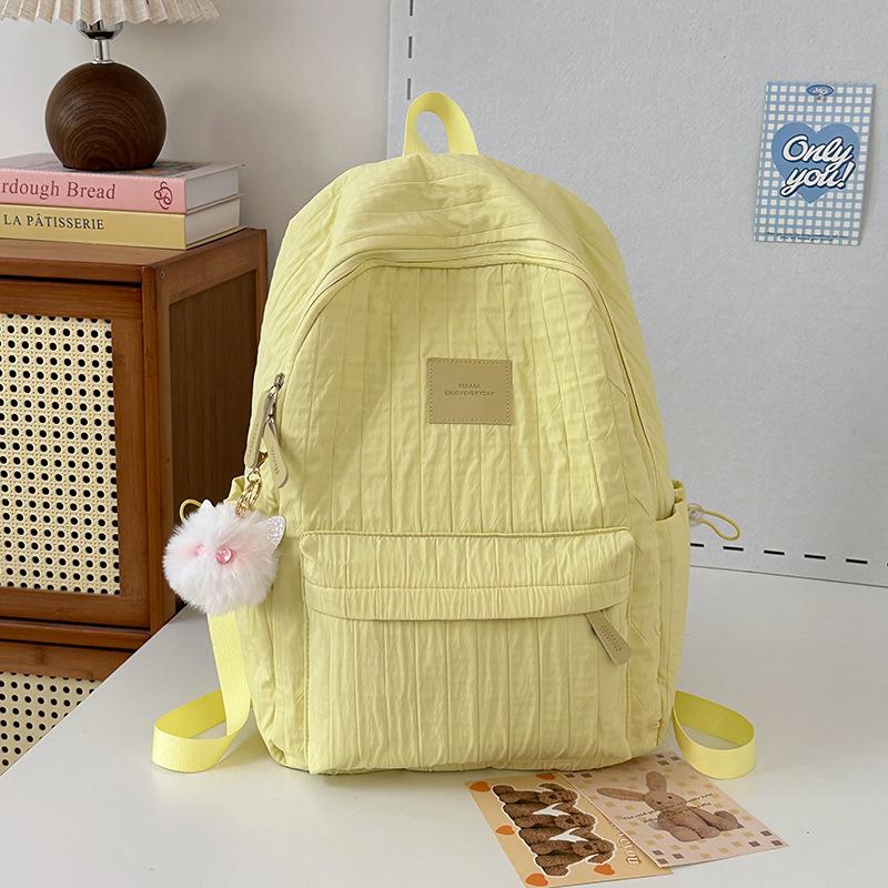 School bag junior high school girls large capacity solid color light primary school backpack high value girl versatile backpack