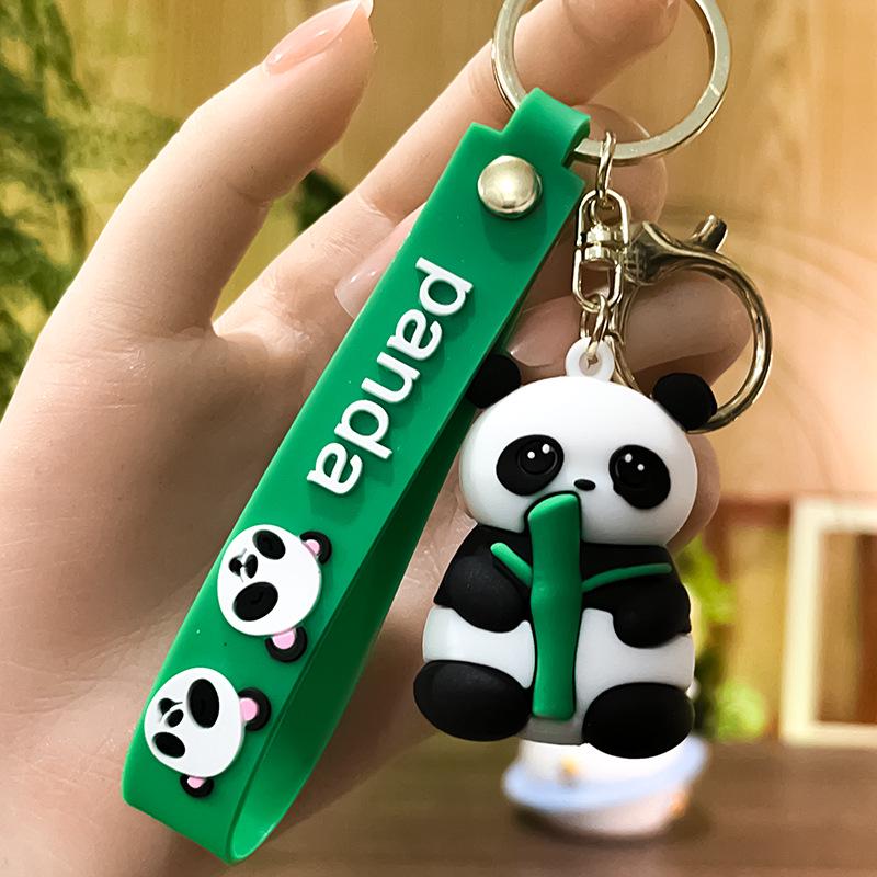 

Red Panda Bamboo-Holding PVC Keychain – Soft Rubber Giant Panda Pendant and Small Gift Bag Accessory.
