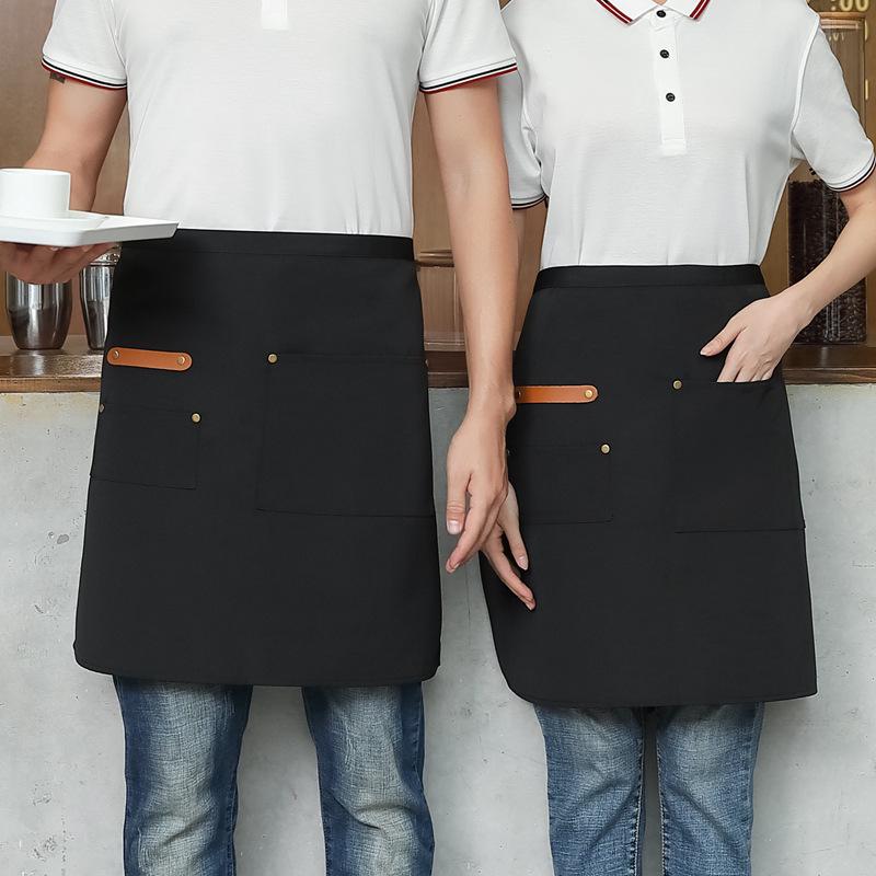 Unisex vanntett kjøkkenforkle i kanvas med halvlangt design og logo i midjen