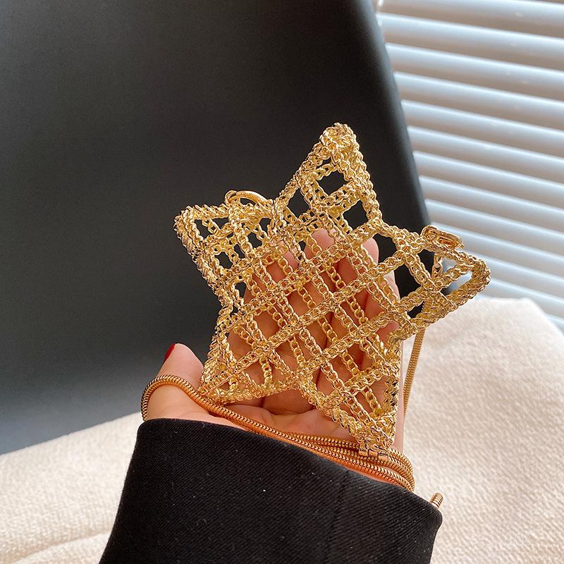 

Hollow metal star bag autumn 2025 new European and American fashion design ins women s messenger dinner bag tide золотий