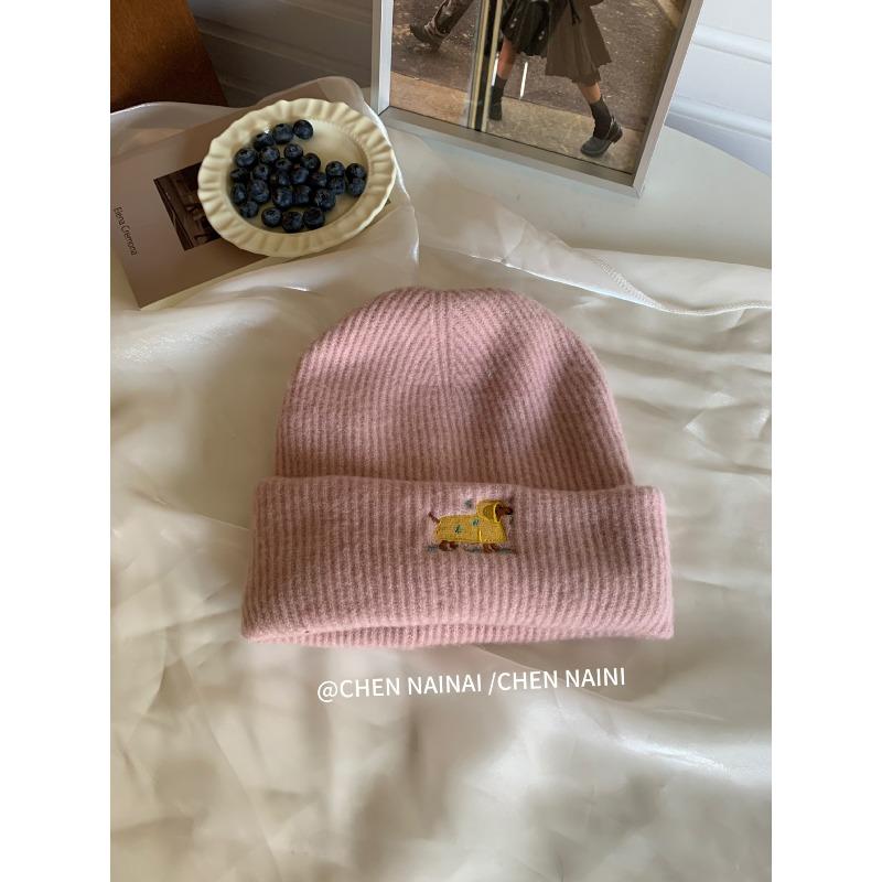 Embroidered Woolen Caps Are Cute for Children In Autumn and Winter. They Are Small Knitted Caps with Big Heads That Show Off Their Faces