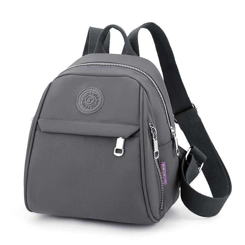 

Простий та модний дорожній рюкзак для матерів середнього віку та повсякденний рюкзак для жінок сірий колір