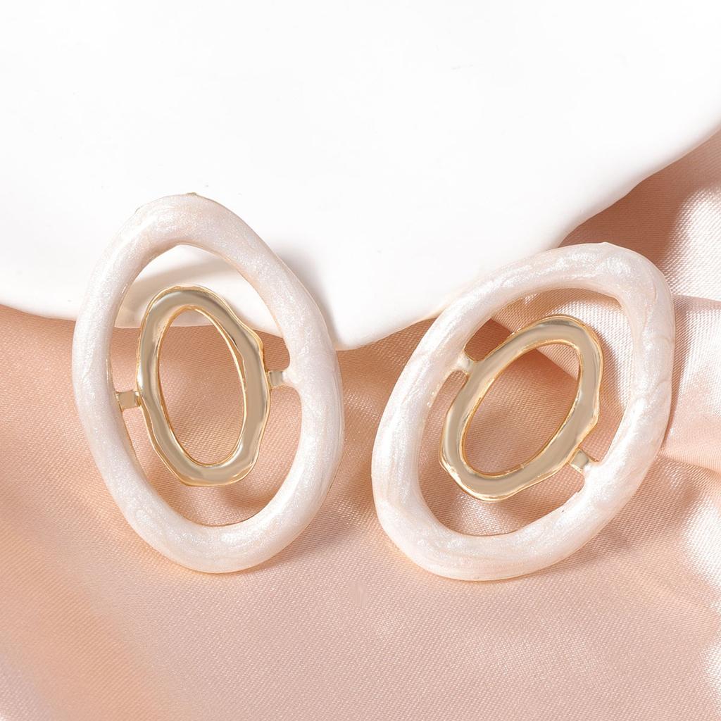 Korean version of dopamine color hollow geometric creative design sense round alloy stud earrings daily commuting