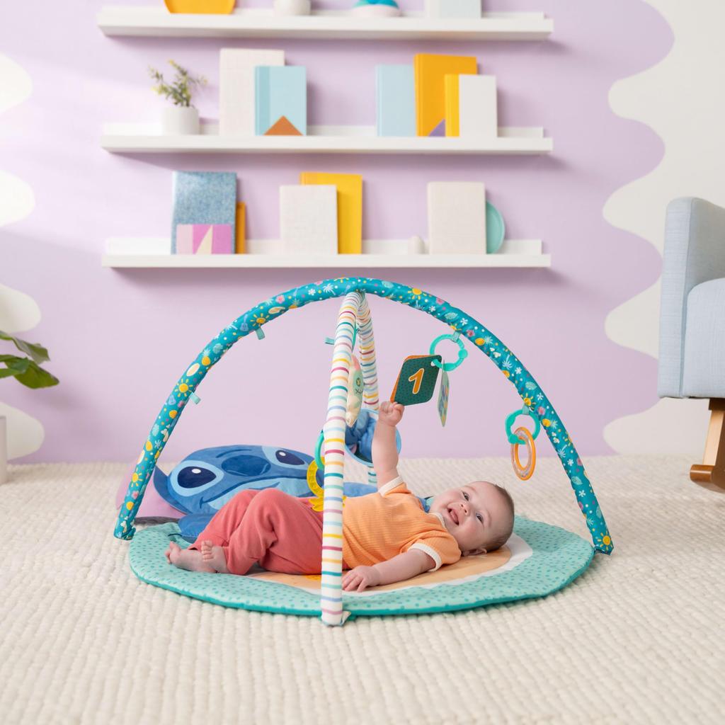 Bright Starts Disney Baby Stitch Party in Paradise Play Gym Mat with 5 including a removable Stitch plush Suitable for ages 0M and & Toys, toy. up.