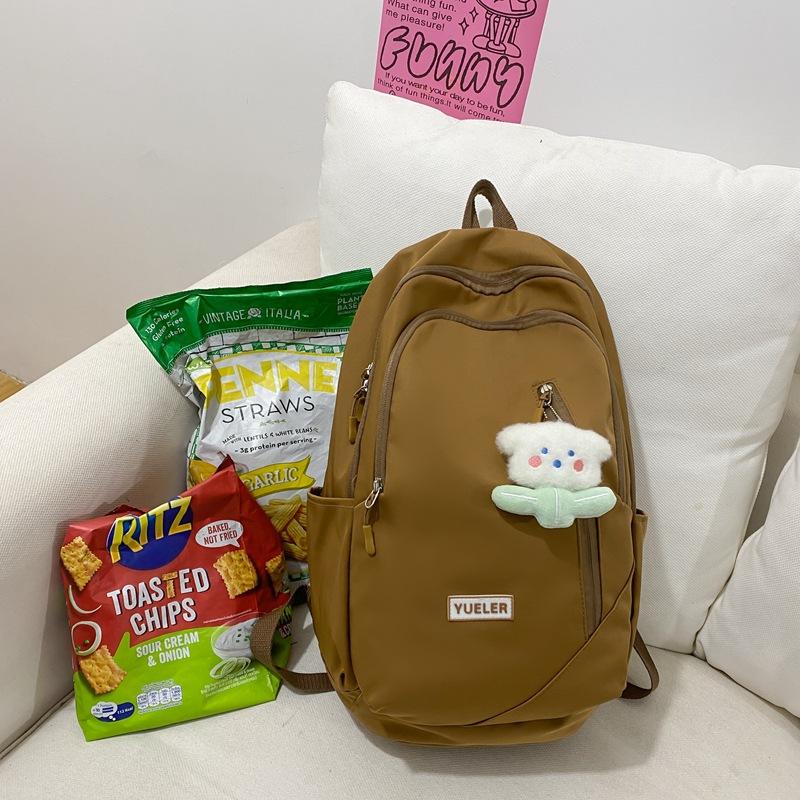 

Thin and light men s and women s backpacks Large capacity casual simple high school cute pendant College student travel backpack single package