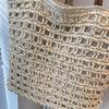 Handwoven Straw Tote Bag with Leather Handles and Open Weave Design Perfect for Summer Beach and Casual Outings