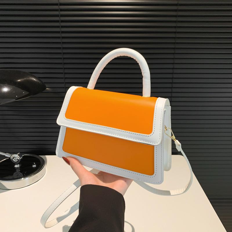 Splicing color clamshell type casual summer new simple Korean version fashionable foreign style women's hand carry shoulder small square bag soft