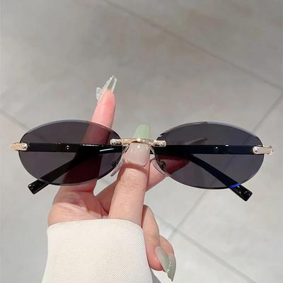Personalized Oval Frame Sunglasses Retro Women Men Metal High-End Sunglasses Luxuy Frameless Trimming Traveling Uv400 Sunglasses