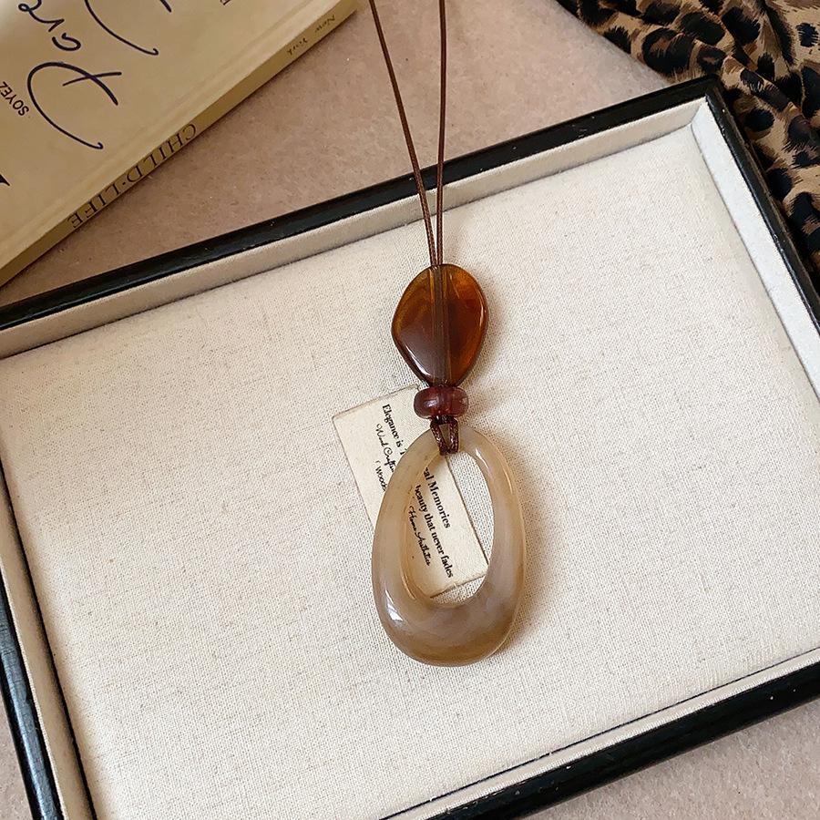 Retro Ethnic Heart Necklace: Wooden Flower Pendant Sweater Chain for Women