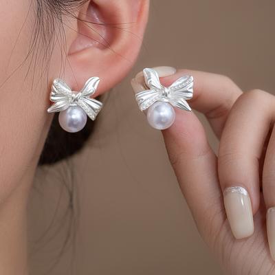 Bow Pearl Earrings Women'S Niche Design Sense Retro Simple Stud Earrings Temperament Advanced Sense Earrings