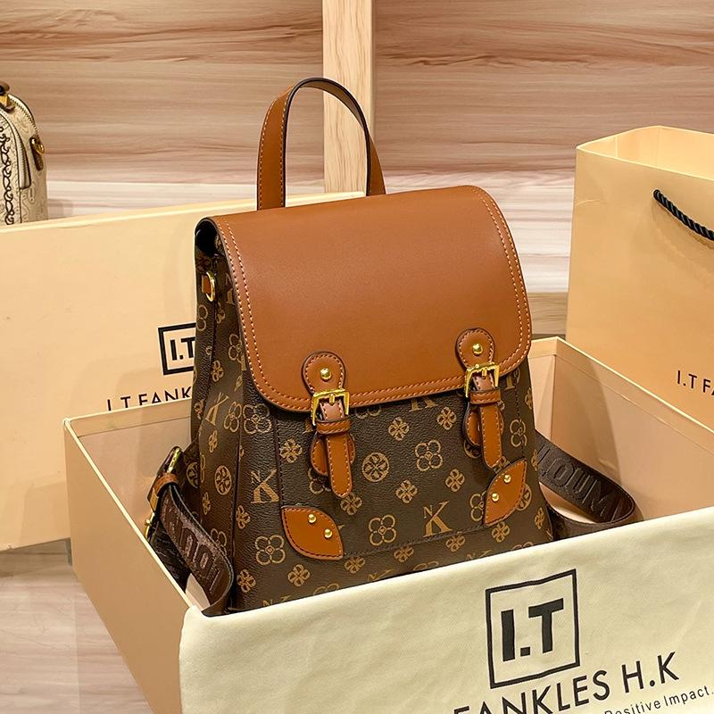 Guangzhou Rucksack aus echtem Leder Damen Neu Herbst und Winter Modisch Vintage Blume Große Kapazität Rucksack Vielseitig Lässig Reise Tasche