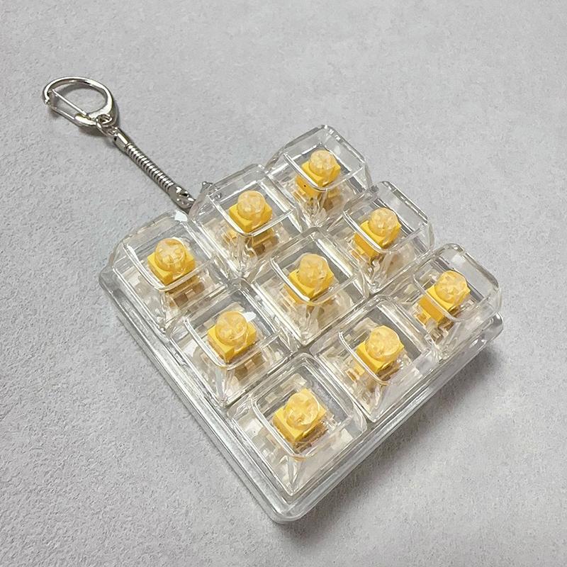 Tastiera a 9 Tasti Keycaps Portachiavi Giocattolo Fidget Keycaps Anti-Ansia Keycaps Festa Sollievo dallo Stress Keycaps Fai-da-Te Tappi Tastiera Giocattolo