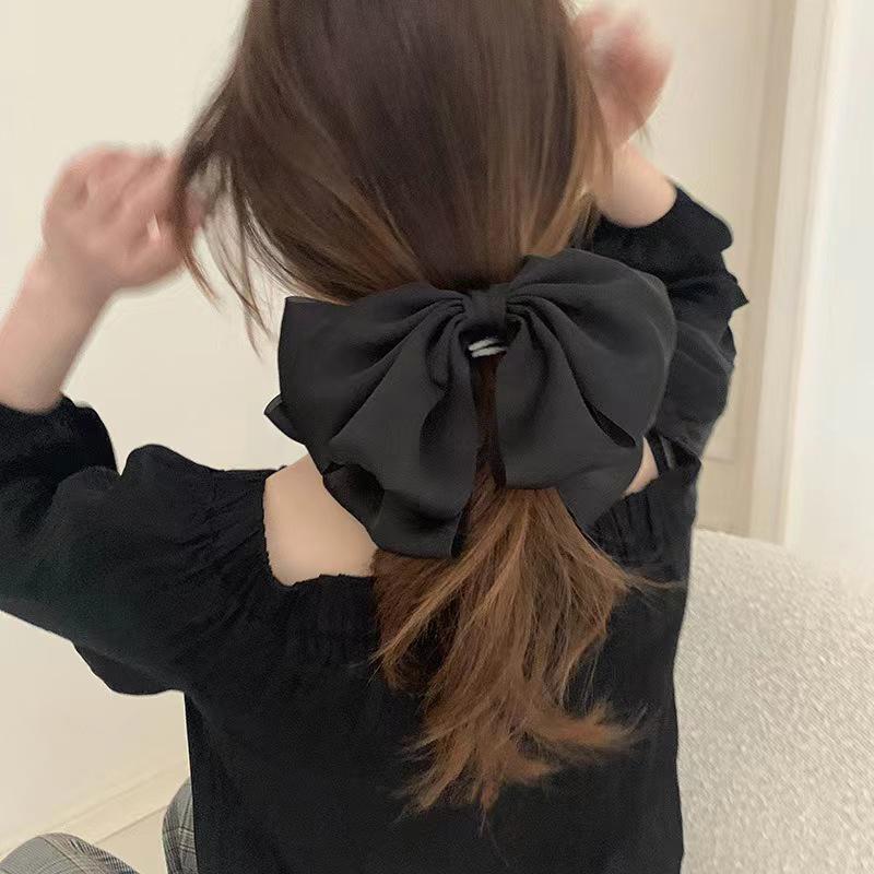 

Sister Yang s Black Bow Hair Clip for Women - Slimming Effect on Ponytail